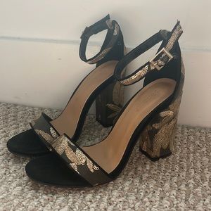 Black and gold heels